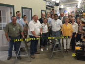 McCoy's Building Supply corporate executives join with employees of the Huntsville, Texas, facility and local Huntsville officials to celebrate the grand re-opening of the store.
