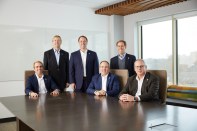 Lansing is truly a family business, with brothers Chase (seated, far left); Hunter (standing, middle); and Ted (standing, far right) all working at the corporate headquarters.