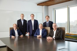 Lansing is truly a family business, with brothers Chase (seated, far left); Hunter (standing, middle); and Ted (standing, far right) all working at the corporate headquarters.