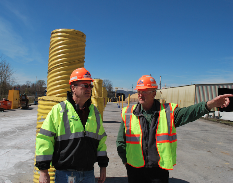 Tom Pachinger (right), project manager for the $30 million upgrade, walks through the plan with Ken McDonald, plant manager for Georgia-Pacific’s Rome Lumber facility.