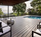 MoistureShield composite decking, shown in Vision's Cathedral Stone color with Fathom horizontal rod steel railing. MoistureShield products will be distributed by Great Southern Wood Preserving, Inc.