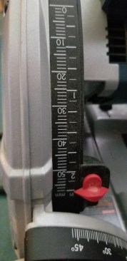 The depth scale is in both millimeters and inches. The red indicator can be set in one of two positions, for use without the track ...