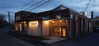 Sheldon Kahan drew inspiration from the Museum of Natural History and Manhattan jewelry shops when creating a showroom that tied Interstate + Lakeland Lumber's present to its past.