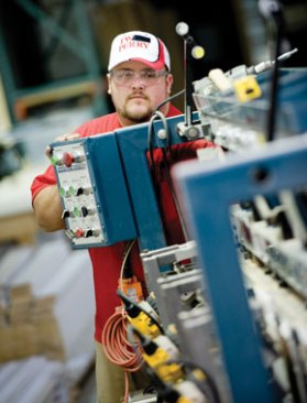 A TW Perry employee works on a custom job