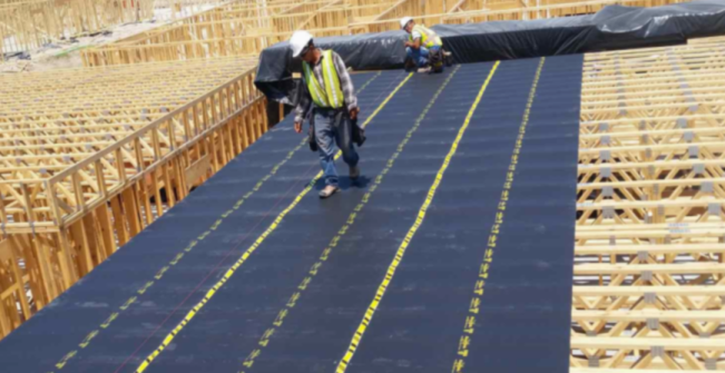 The system’s thin, flexible 1/8-inch-thick polymer sheets are stapled or screwed to studs before drywall.