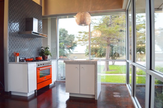 Large windows like these brought in appealing natural light but made kitchen layouts a challenge.