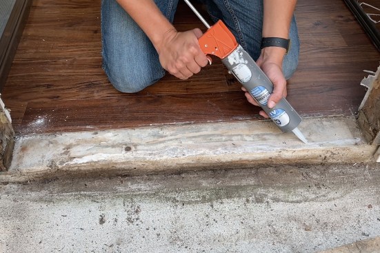 Caulking under sill, damaged jambs
