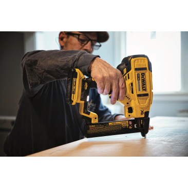 The DeWalt DCN681D1 Cordless Stapler in use building cabinets on-site