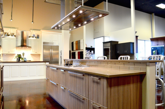 The showroom contains fully functional kitchen vignettes in various styles.