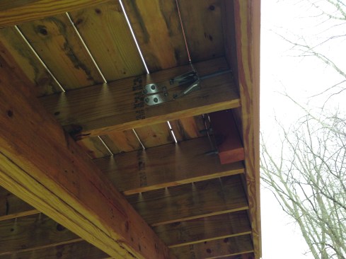 Lateral-load brackets are often required to reinforce the connection between cantilevered joists and the rim joist.
