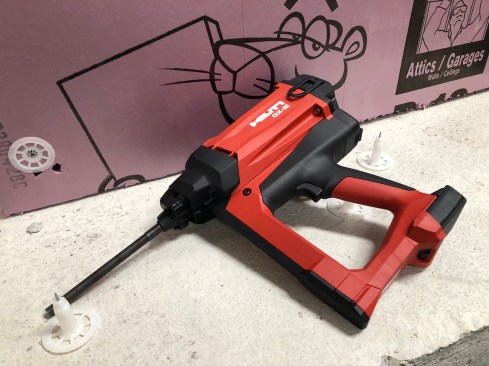 The GX-IE is cordless fastening system for attaching rigid foam (from 1” to 8” thick) to concrete. The system is comprised of a cordless battery / gas powered nailer and anchors specifically sized for the thickness of the rigid foam you’re attaching. Anchors are loaded manually one at a time onto the tool’s driver shaft. A masonry fastener is embedded within the plastic washer-looking device. A driver pin sets the anchor into the concrete when you pull the trigger. It’s available for concrete, though they are working on an option for steel as well. I inquired as to whether or not this would be available in a wood solution as well; they said they were looking into it as a possible option, though there aren’t plans for it currently. The nailer runs on a 12V battery which can fire up to 5,000 shots per charge. Gas cans can deliver up to 8,000 shots and are included in the purchase of fasteners.