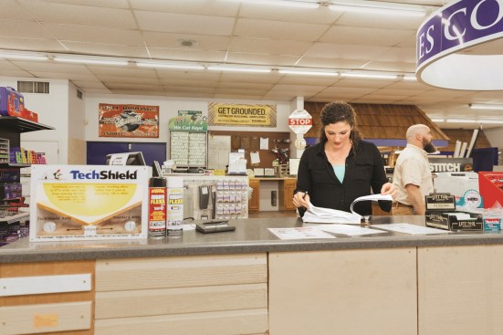 Chilcutt checking on paperwork at one of her stores