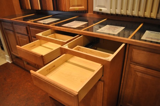 The Details Room houses cabinet units that roll out on trays so showroom staff can talk to customers about the differences between cabinet construction options.