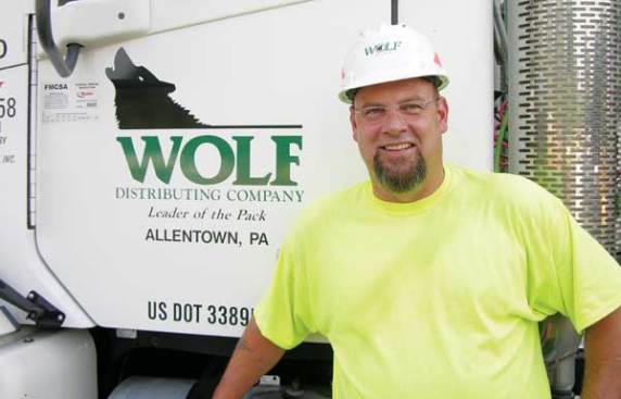 Greg Crossland grew up in a family of truck drivers. He has worked at Wolf Distribution for four years. "This is where I'm happy," he says. "I can't be in an office every day."