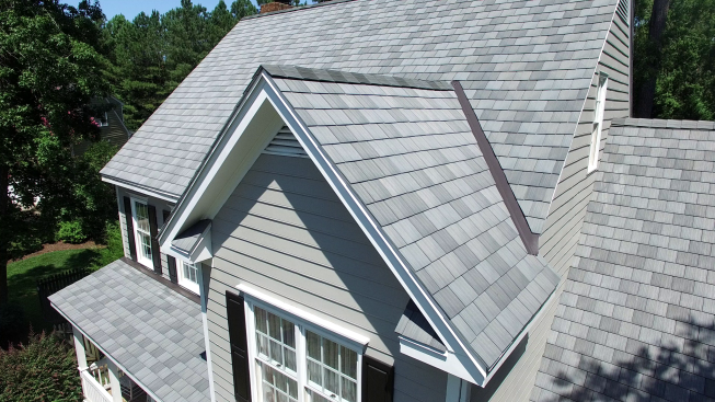 PlyGem is one of several companies offering synthetic, low-maintenance shingles with the look of natural materials. This one, called Engineered Cedar Shake, is made completely from recycled resins.