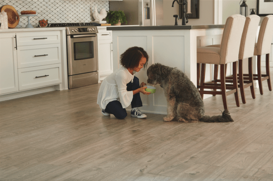 Mohawk’s new Revwood Plus flooring is a 100% waterproof laminate flooring with a wood look that the company describes as somewhere between hardwood and vinyl.