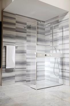 TOTO's NEOREST shower booth lets users control water volume and temperature from inside and outside the shower. The zero-clearance shower is available with left- or right-side installations. 888.295.8134. www.totausa.com.
