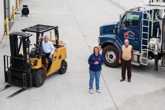 Ray Grice (left) is commodities buyer for Safrit's and its affiliates while Raena Matthews (center) manages the companies' central distribution facility. Bobby Austin (right) serves as COO and VP of operations, particularly logistics. They're shown at the central dispatching operation of Cedar Point, NC.

